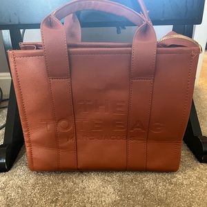 Marc Jacobs small tote bag but as you can see it’s bent a little.